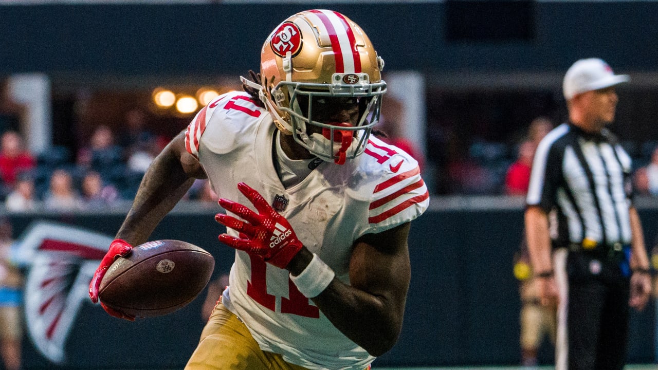 49ers wide receiver Brandon Aiyuk hurdles for touchdown, shows