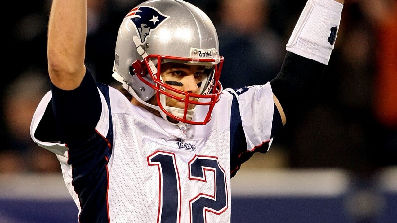 New England Patriots quarterback Tom Brady is pressured by New York Jets  Shaun Ellis in the fourth quarter of week 2 of the NFL season at Giants  Stadium in East Rutherford, New