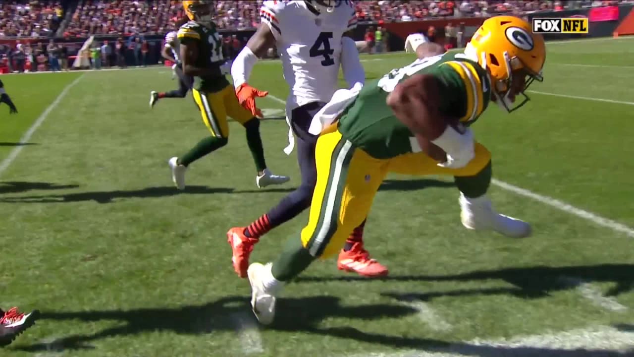 Miami. FL USA; Green Bay Packers running back AJ Dillon (28) is tripped up  while running with the ball short of the end zone during an NFL game again  Stock Photo - Alamy