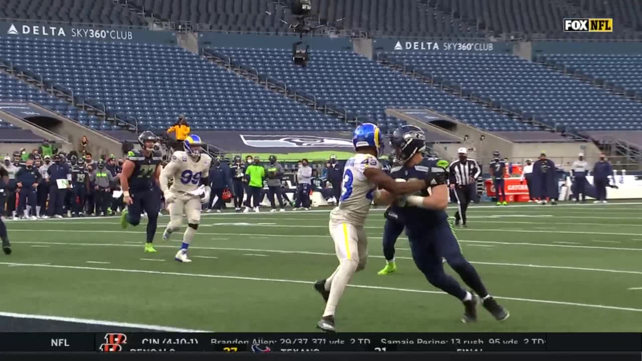 Seattle Seahawks quarterback Russell Wilson takes it to the pylon for