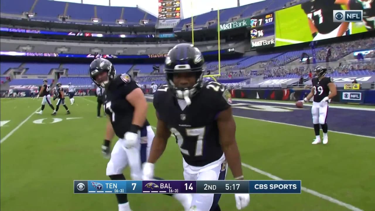 Baltimore Ravens quarterback Lamar Jackson connects with running back J