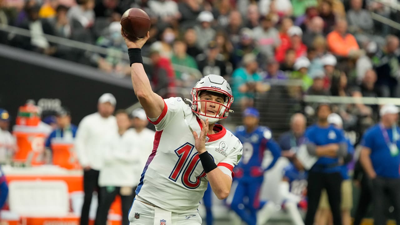 New England Patriots quarterback Mac Jones squeezes tight-window