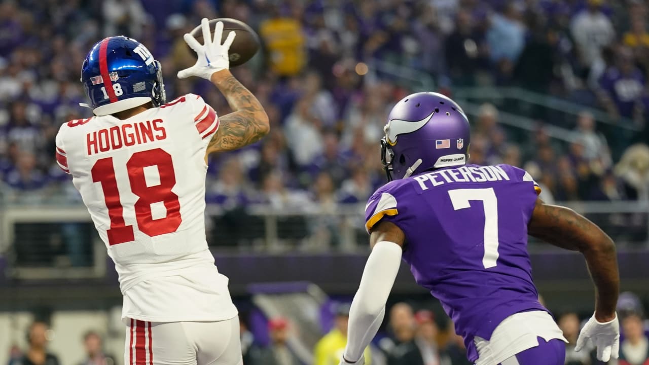 New York Giants wide receiver Isaiah Hodgins (18) runs with the ball  against the Washington Commanders during an NFL football game Sunday, Dec.  4, 2022, in East Rutherford, N.J. (AP Photo/Adam Hunger