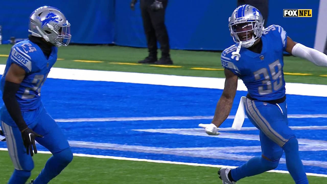 Detroit Lions cornerback Jerry Jacobs takes quarterback Kirk Cousins to