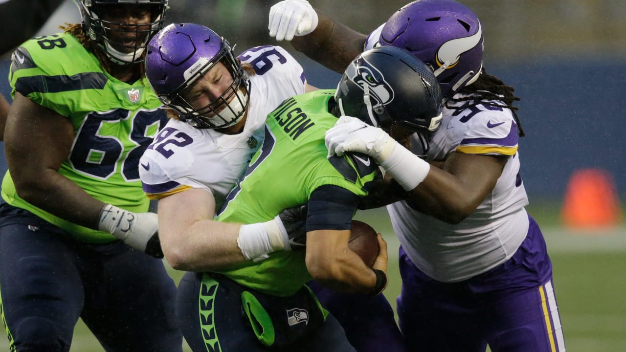 Minnesota Vikings rookie defensive tackle James Lynch leads charge  toSeattle Seahawks quarterback Russell Wilson for Vikings' third sack