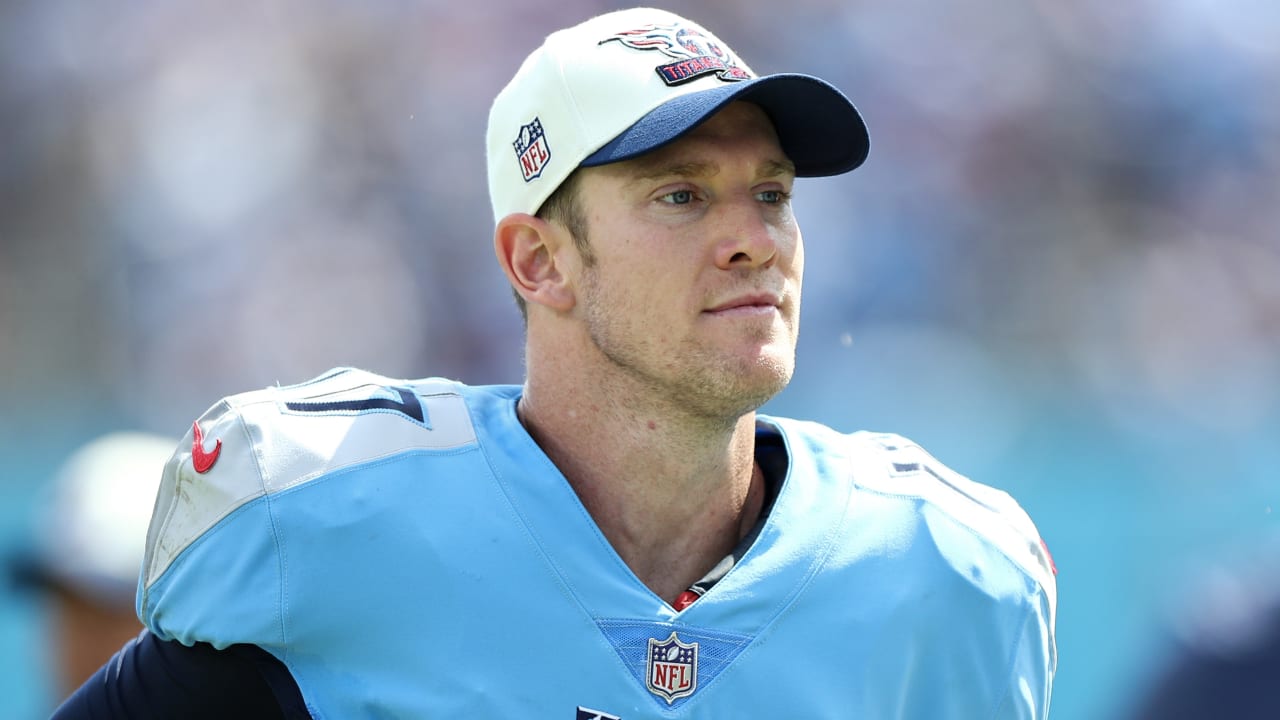 Ryan Tannehill of the Tennessee Titans runs the ball and is chased