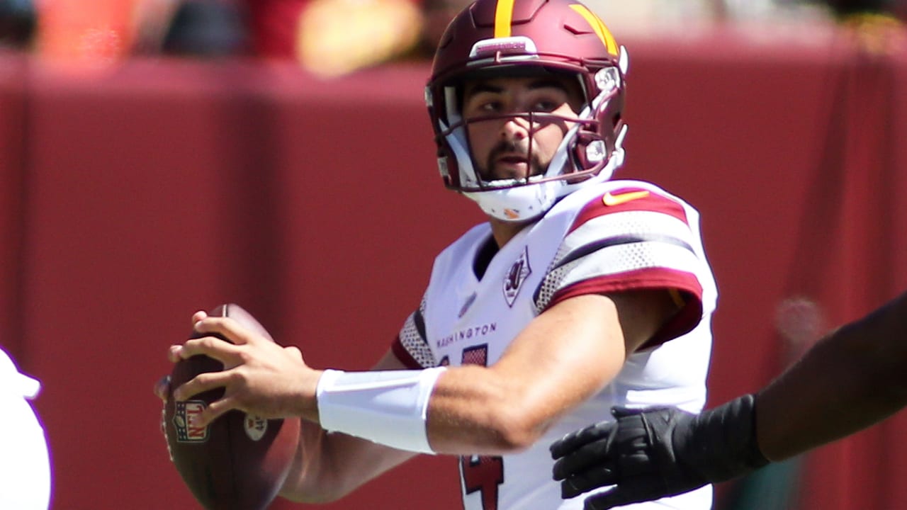 Washington Commanders quarterback Sam Howell (14) throwing the ball before  the start of an NFL football game against the Buffalo Bills, Sunday, Sept.  24, 2023, in Landover, Md. (AP Photo/Evan Vucci Stock