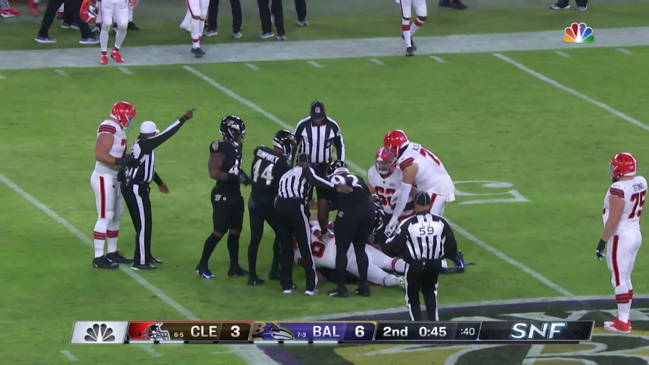 Baltimore Ravens rookie linebacker Odafe Oweh scoops a slippery ...