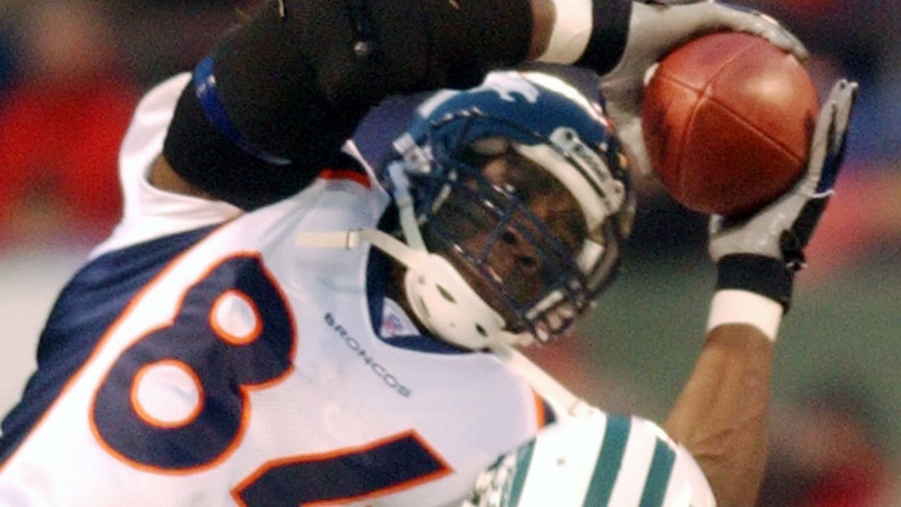 Denver Broncos tight end Shannon Sharpe leaves the field January 4