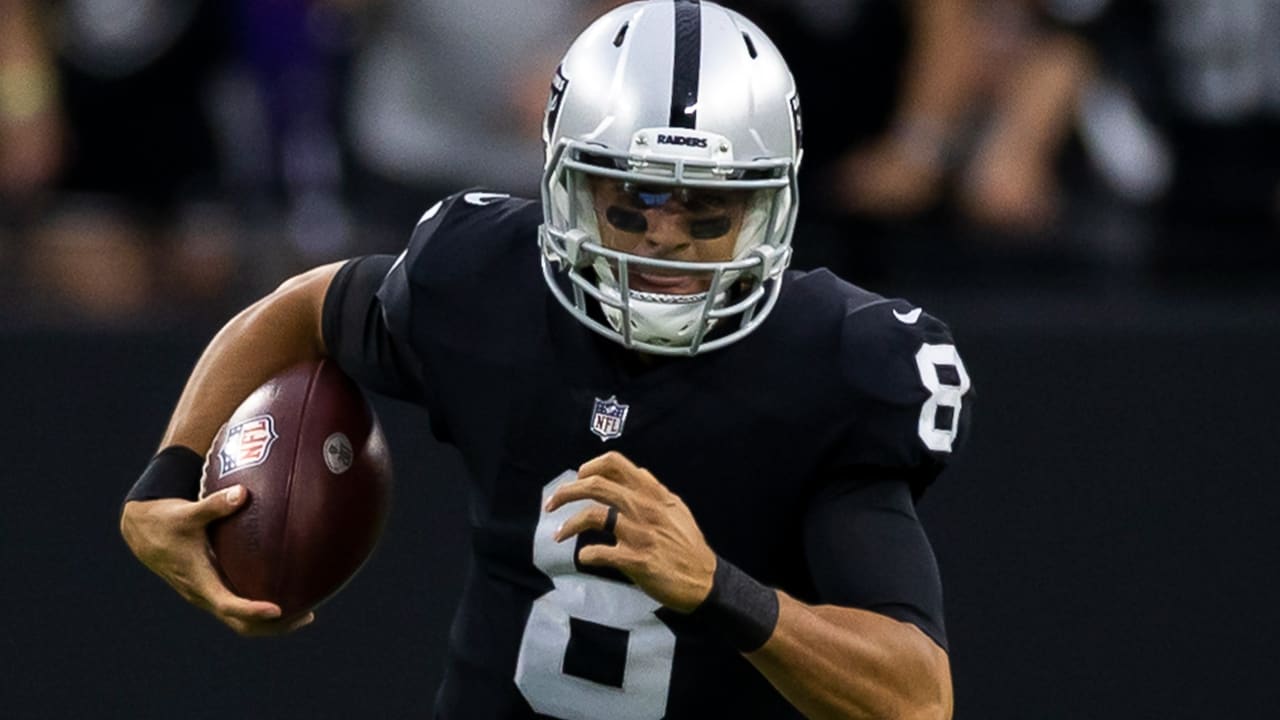 Raiders quarterback Marcus Mariota (8) dives for yardage against