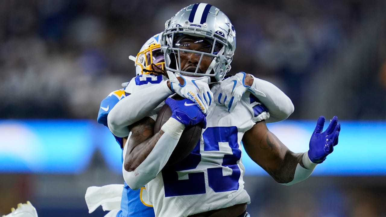 Dallas Cowboys running back Rico Dowdle plunges through a goal-line pileup  for rushing touchdown