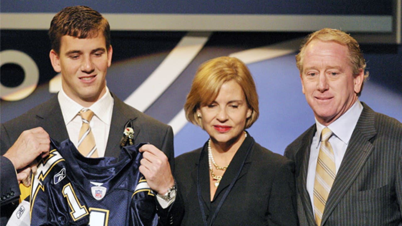 Utah quarterback Alex Smith, left, holds up a San Francisco 49ers jersey  with NFL commissioner Paul Tagliabue after the 49ers selected him as the  No. 1 overall pick in the NFL Draft