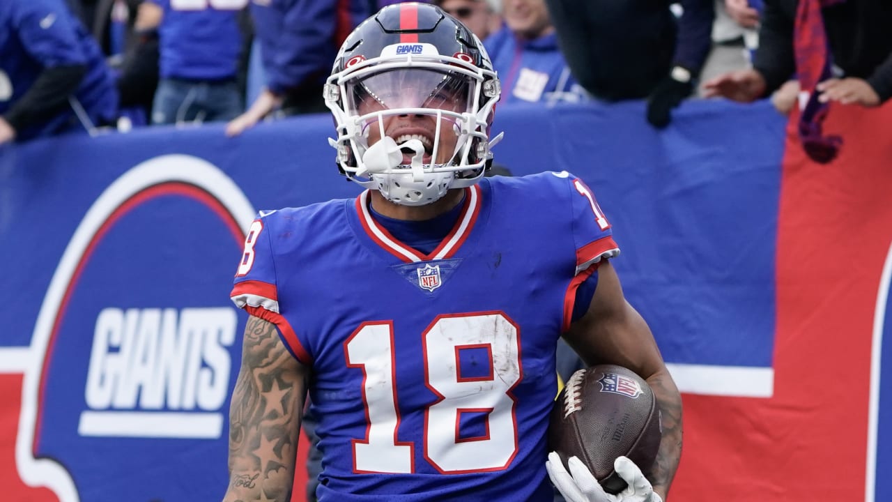 New York Giants' Isaiah Hodgins catches a touchdown pass during the second  half of an NFL football game against the Washington Commanders, Sunday, Dec.  4, 2022, in East Rutherford, N.J. (AP Photo/John