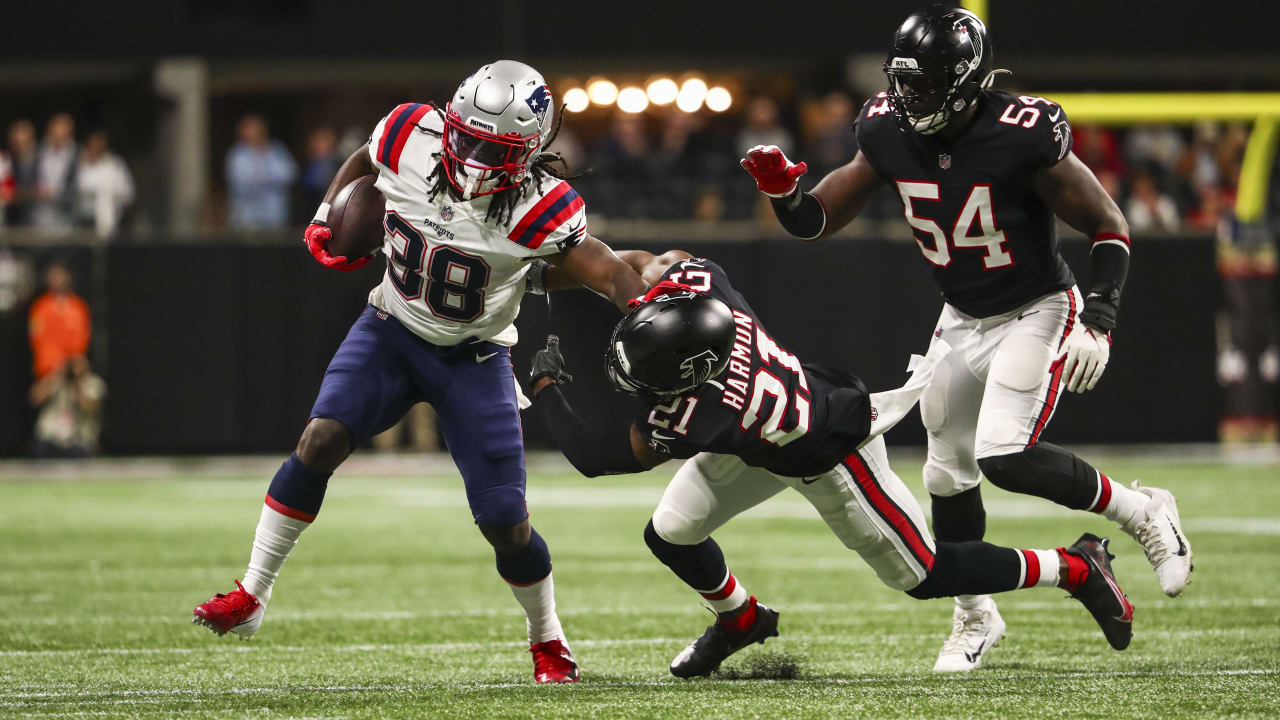 New England Patriots running back Rhamondre Stevenson throws Atlanta  Falcons defensive back to ground with furious stiff arm