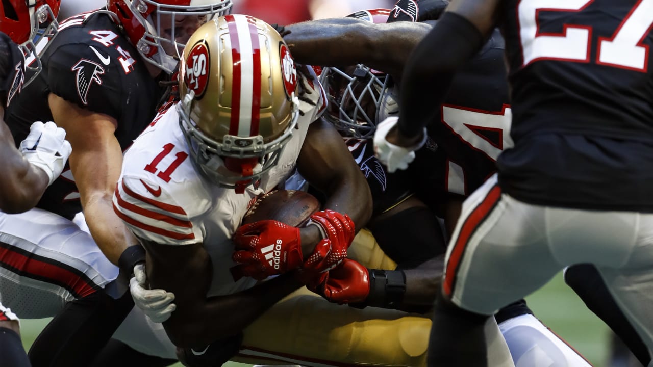 Santa Clara, California, USA. 18th Oct, 2020. San Francisco 49ers wide  receiver Brandon Aiyuk (11) celebrates touchdown with team member in front  of TV screen on Sunday, October 18, 2020, at Levis