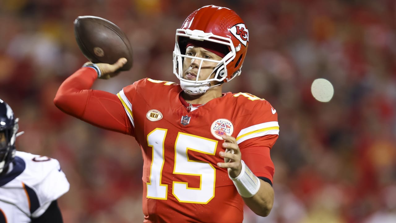 Kansas City Chiefs quarterback Patrick Mahomes staves off a wouldbe