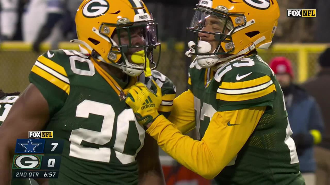 Green Bay Packers safety Rudy Ford (20) celebrates intercepting a Dallas  Cowboys quarterback Dak Prescott pass during the first half of an NFL  football game Sunday, Nov. 13, 2022, in Green Bay