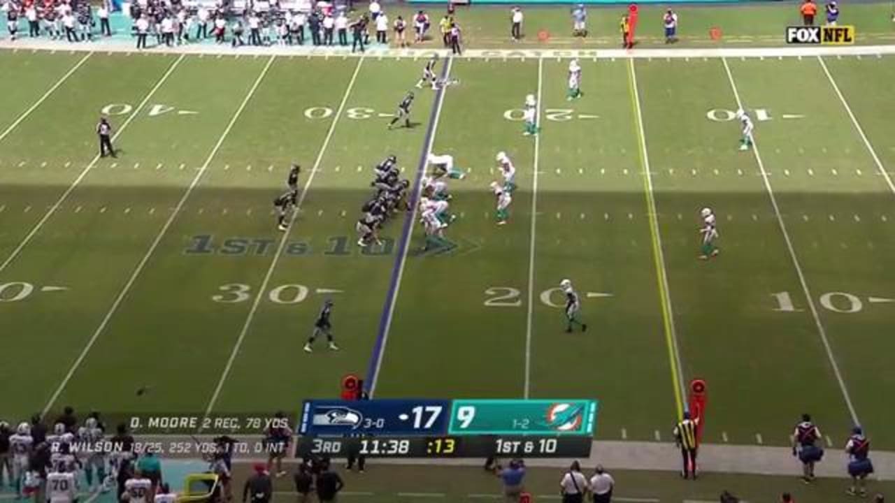 Seattle Seahawks running back Chris Carson effortlessly hurdles a Miami ...