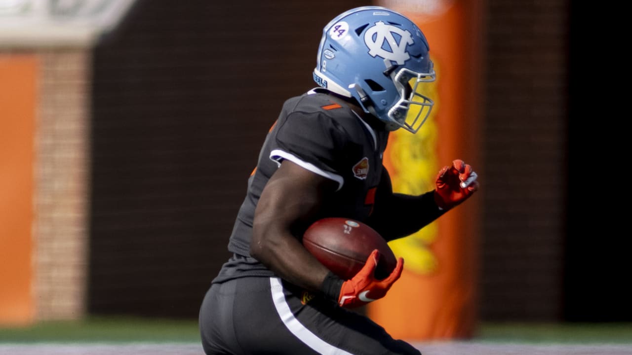 North Carolina running back Michael Carter shrugs off a slew of