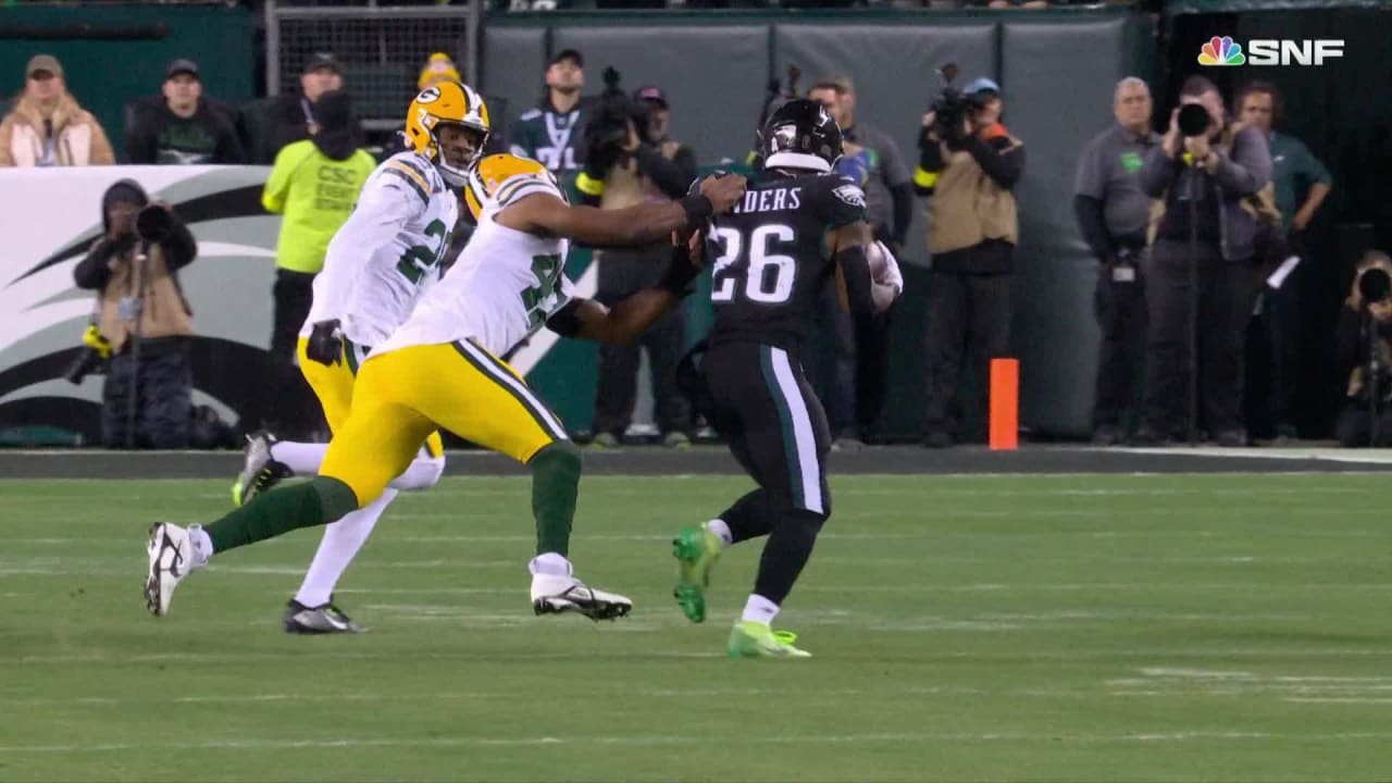 Green Bay Packers linebacker Justin Hollins drags down Philadelphia Eagles  running back Miles Sanders for a tackle or a loss in his first game with  Packers