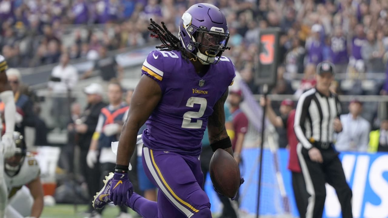 FILE - Minnesota Vikings running back Alexander Mattison (2) breaks a  tackle to score a touchdown in the first quarter of an NFL match between  Minnesota Vikings and New Orleans Saints at