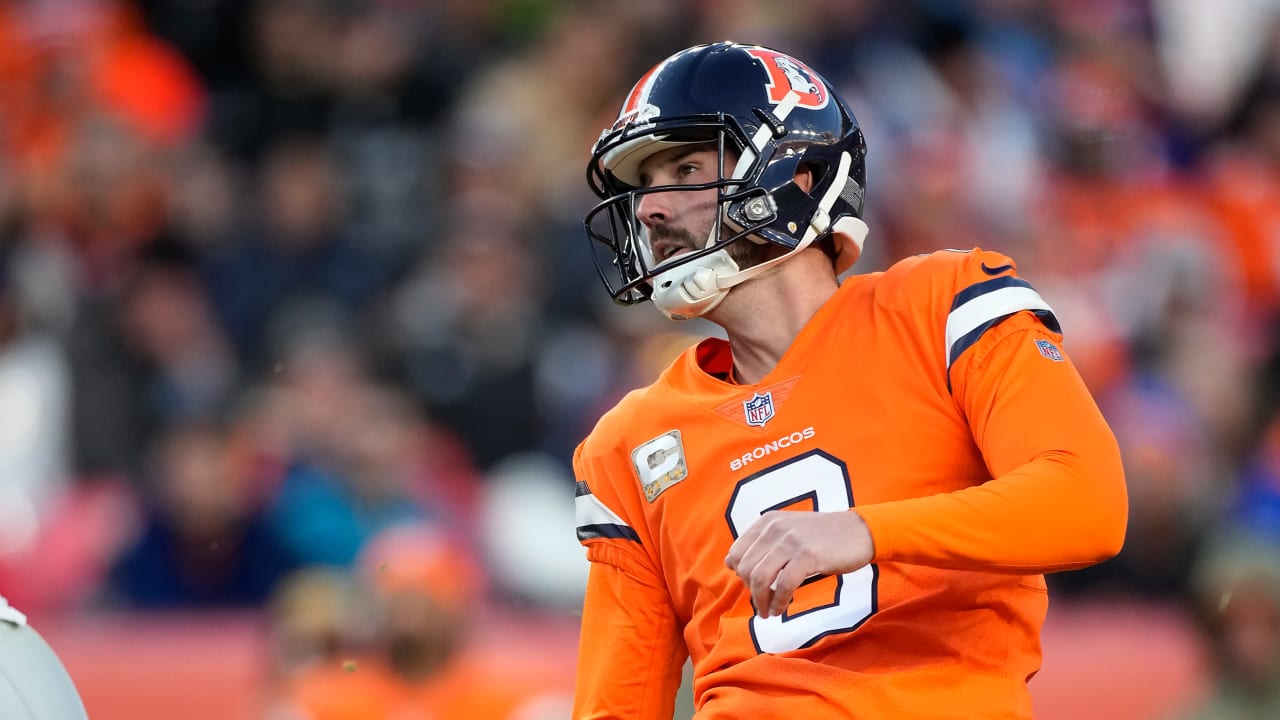 Denver Broncos place kicker Brandon McManus (8) kicks the ball