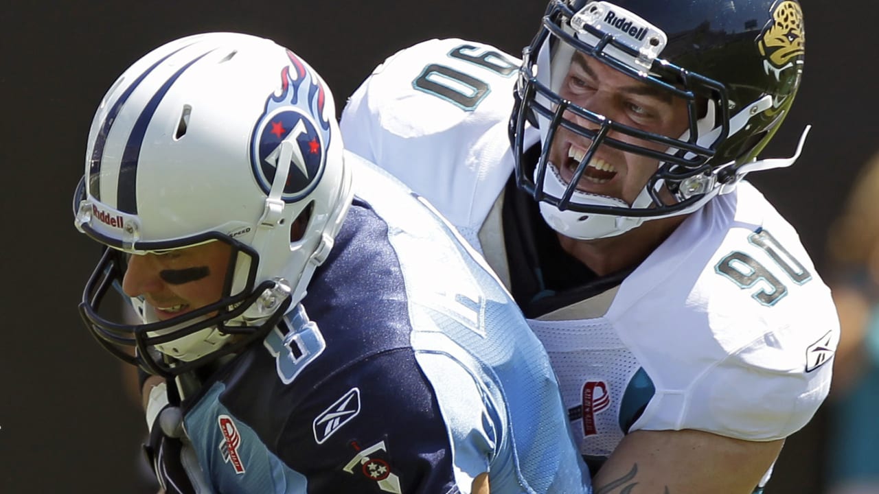 Jacksonville Jaguars' Rashean Mathis (27), left, is tackled by his hair by  Tennessee Titans' Jared Cook (89) on a return play during the second half  of an NFL football game in Jacksonville