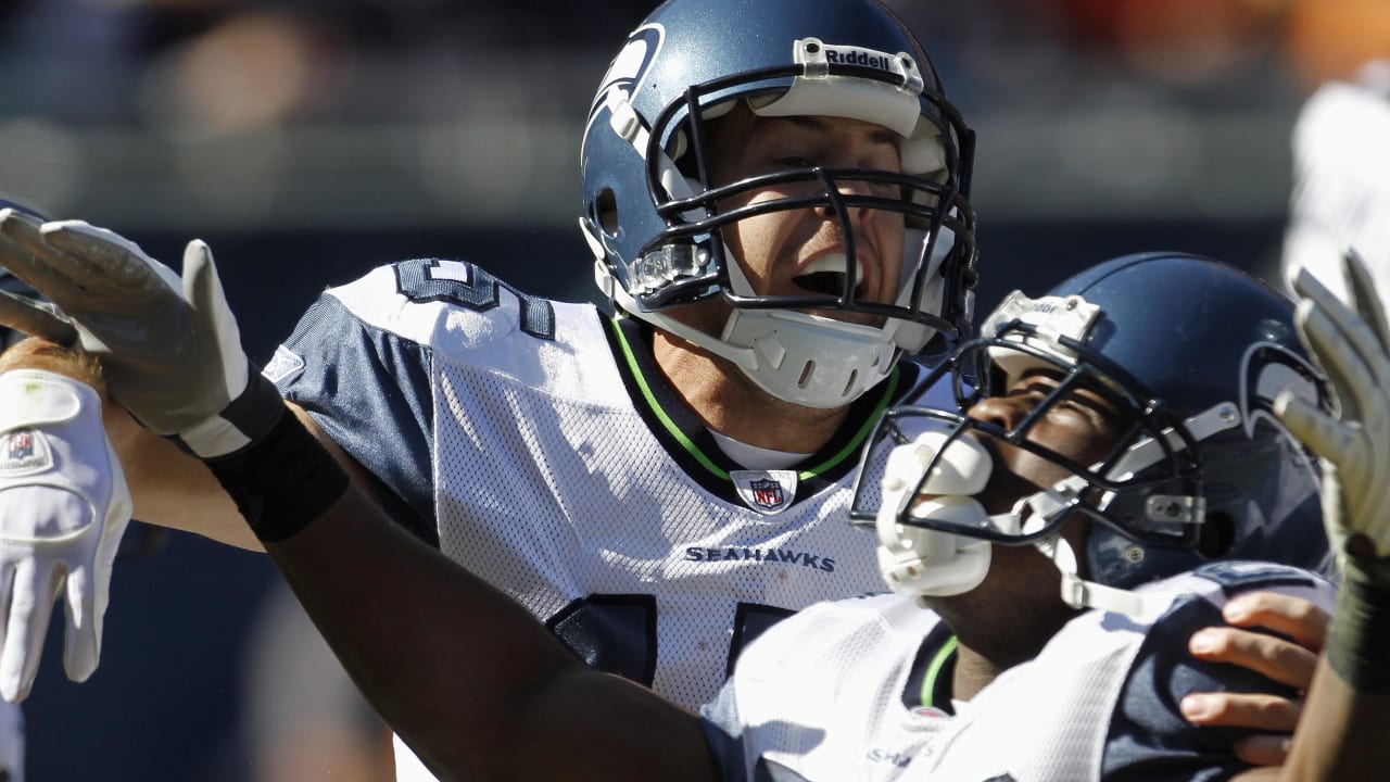 Chicago Bears wide receiver Devin Hester (23) celebrates with teammate  Corey Wootton (98) after scoring on an 89-yard punt-return in the fourth  quarter against the Seattle Seahawks of an NFL football game