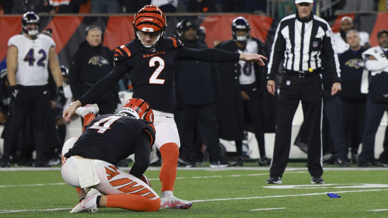 Cincinnati Bengals place kicker Evan McPherson (2) runs for the play during  an NFL wild-card football game against the Baltimore Ravens on Sunday, Jan.  15, 2023, in Cincinnati. (AP Photo/Emilee Chinn Stock