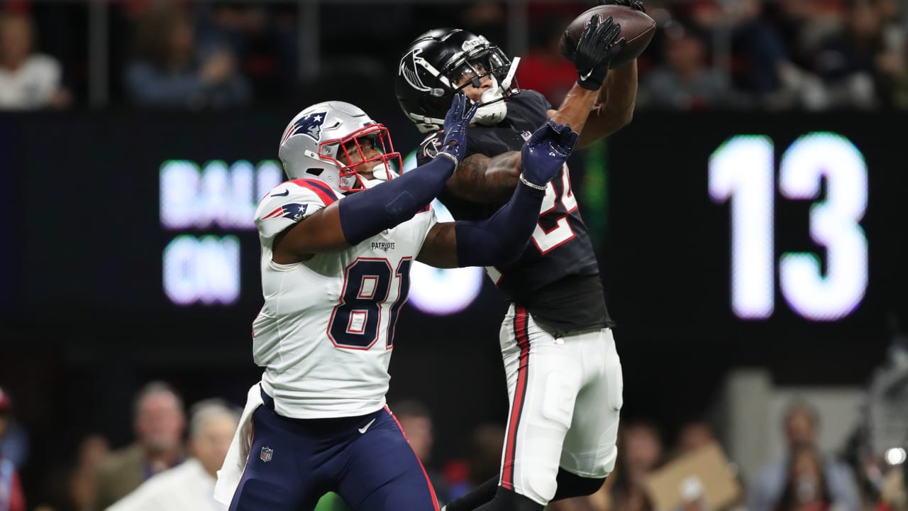 Atlanta Falcons cornerback A.J. Terrell leaps in front of New England  Patriots tight end Jonnu Smith to high-point interception