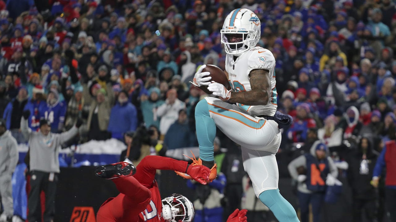 Miami Dolphins running back Salvon Ahmed (26) breaks the tackle of Raiders  defensive tackle Mau …