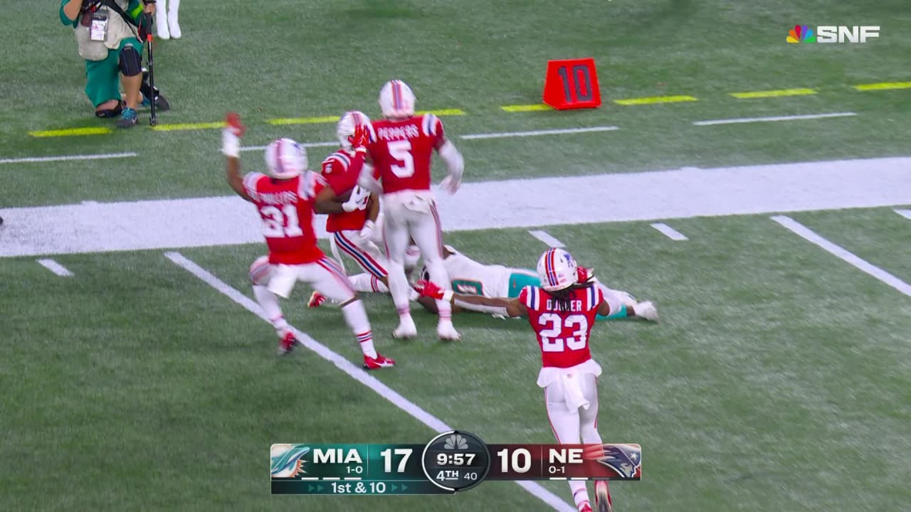 New England Patriots rookie cornerback Christian Gonzalez highpoints Miami Dolphins quarterback