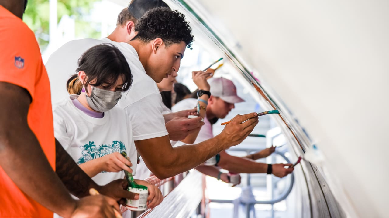 Miami Dolphins players hand out supplies at North Fort Myers High School