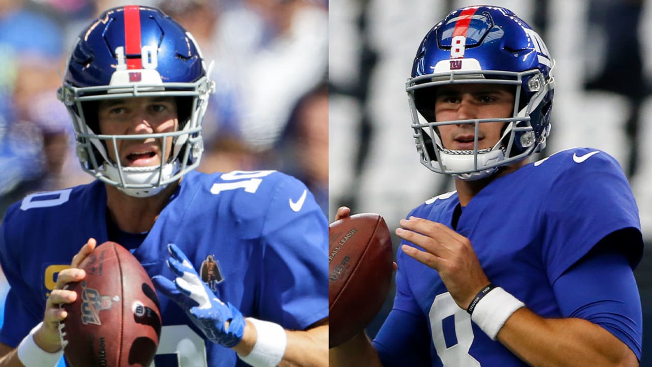 New York Giants Eli Manning puts his hands on his helmet in the