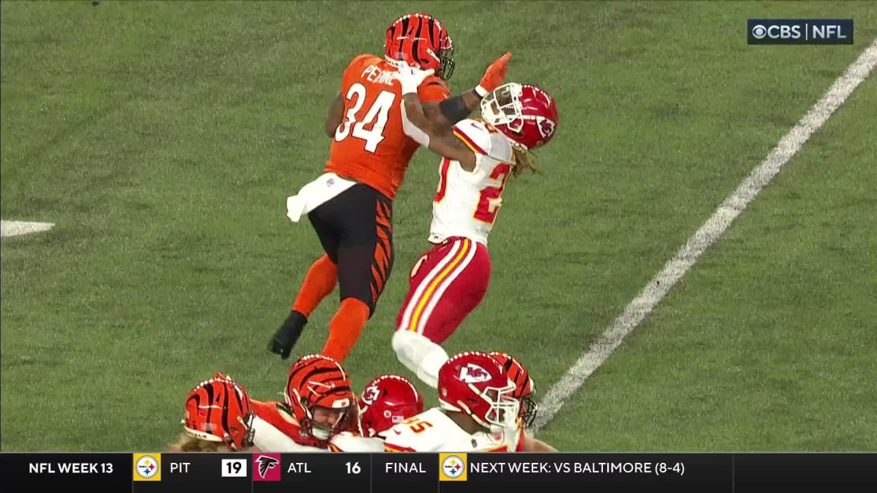 Cincinnati Bengals running back Samaje Perine stiff-arms Kansas City Chiefs  safety Justin Reid into turf on 9-yard run