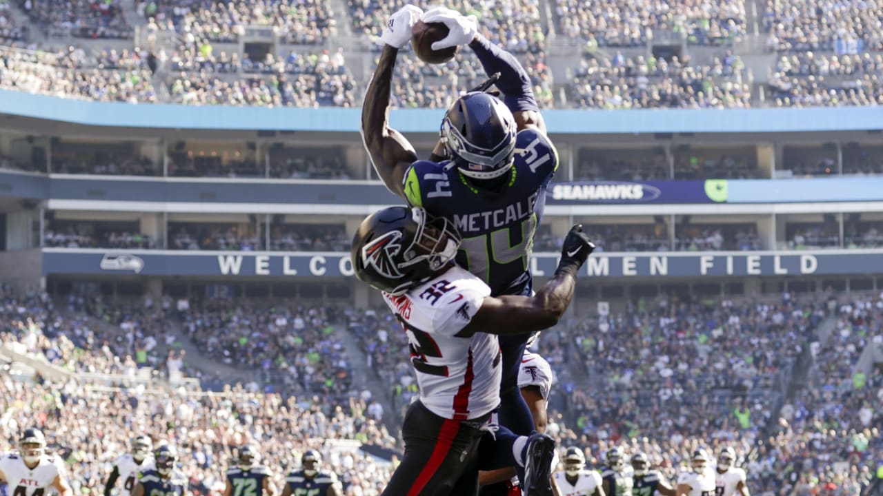 DK Metcalf of the Seattle Seahawks reacts after diving to make a