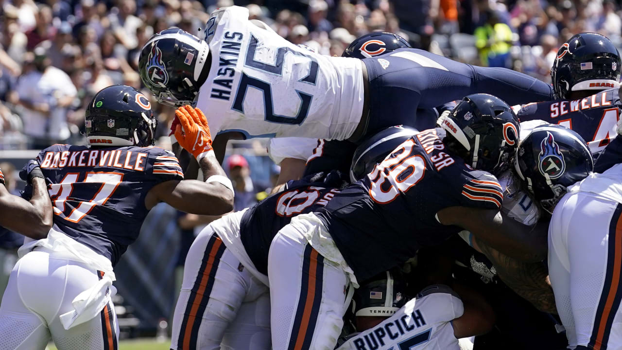 Tennessee Titans running back Hassan Haskins (25) runs during an