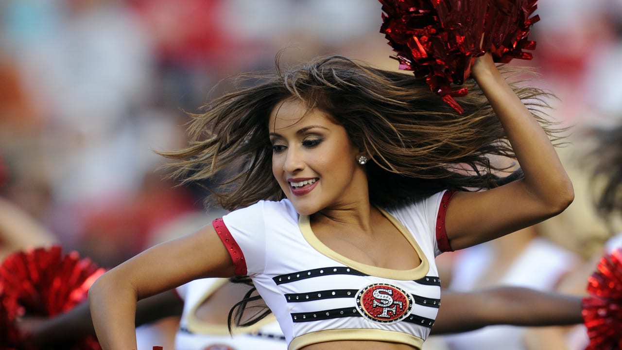 A Washington Commanders cheerleader performs during the first half of an  NFL preseason football game between the Washington Commanders and the  Baltimore Ravens, Monday, Aug. 21, 2023, in Landover, Md. The Commanders