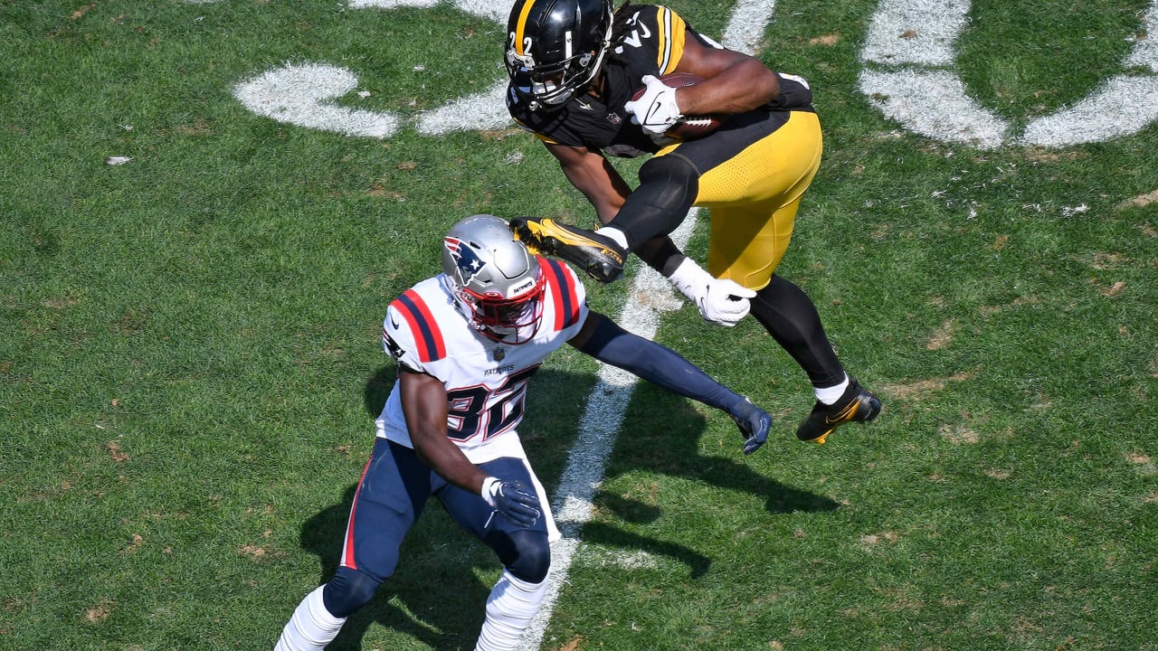 Najee Harris pushing his way up the stiff-arm ladder 