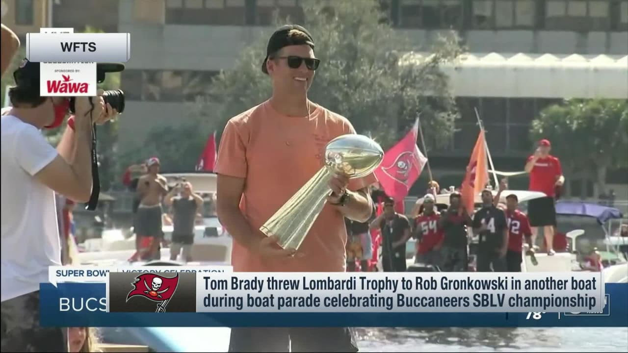 Tom Brady Throws Super Bowl Trophy Celebrating Win in Boat Parade