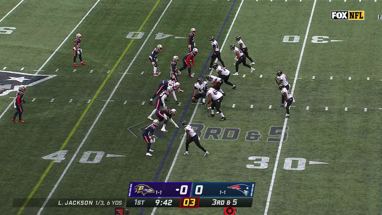 Baltimore Ravens quarterback Lamar Jackson gets away from New England  Patriots' blitz for 8-yard scramble