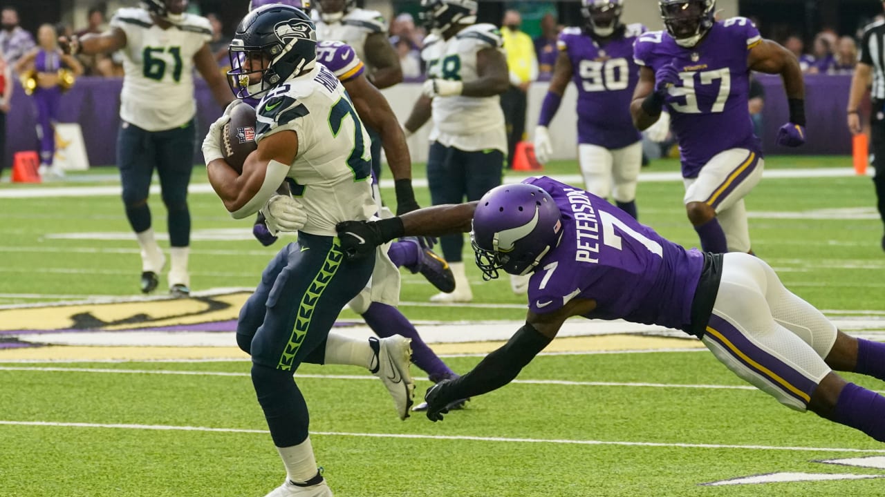 Seattle Seahawks running back Travis Homer (25) toplles over Pittsburgh  Steelers safety Tre Norwood (21) on a run during the first half of an NFL  preseason football game, Saturday, Aug. 13, 2022