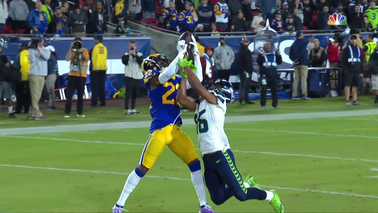 Troy Hill leaps over Lockett for endzone interception