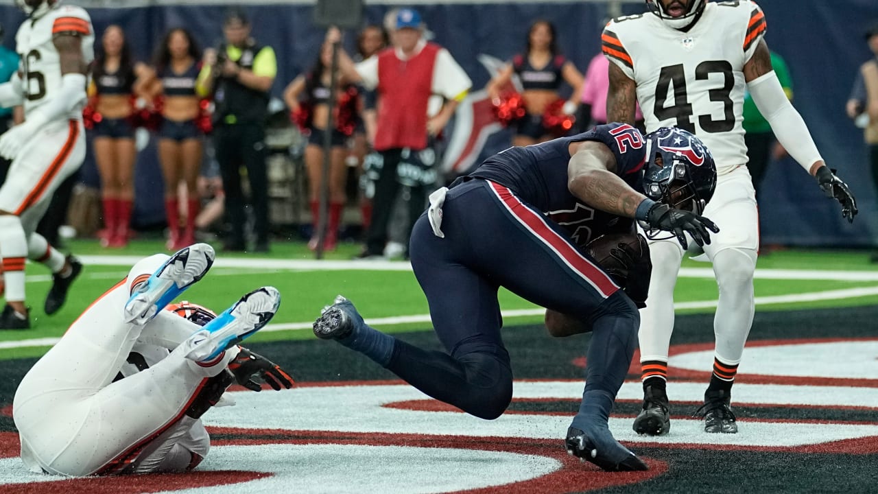 Nico Collins of the Houston Texans runs a pass in for a touchdown