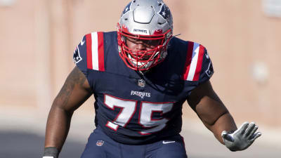 New England Patriots offensive lineman Justin Herron (75) runs a play  during an NFL football game against the Miami Dolphins, Sunday, Jan. 9,  2022, in Miami Gardens, Fla. (AP Photo/Doug Murray Stock