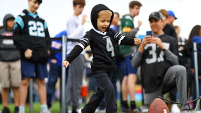 People attend events at NFL South Bank, in London, Saturday, Oct. 1, 2022.  NFL UK will be hosting a takeover of London's South Bank to celebrate the  beginning of the 2022 International