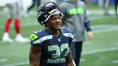 Seattle Seahawks running back Chris Carson (32) rushes at Cleveland Browns  defensive back T.J. Carrie (38) during an NFL football game in Cleveland,  Sunday, Oct. 13, 2019,(AP Photo/Rick Osentoski Stock Photo - Alamy