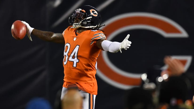 Chicago Bears' Walter Payton (34) comes in for a landing on top of