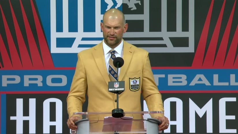 Joe Klecko, left, a member of the Pro Football Hall of Fame Class of 2023,  receives his gold jacket from Howie Long during the gold jacket dinner in  Canton, Ohio, Friday, Aug.