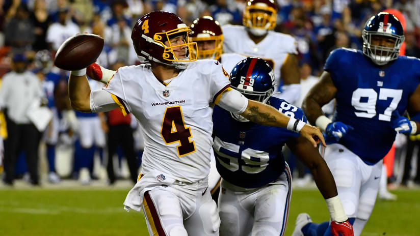 Washington Football Team quarterback Taylor Heinicke signals touchdown  against the New England Patriots during an NFL preseason football game at  Gillette Stadium, Thursday, Aug. 12, 2021 in Foxborough, Mass. (Winslow  Townson/AP Images